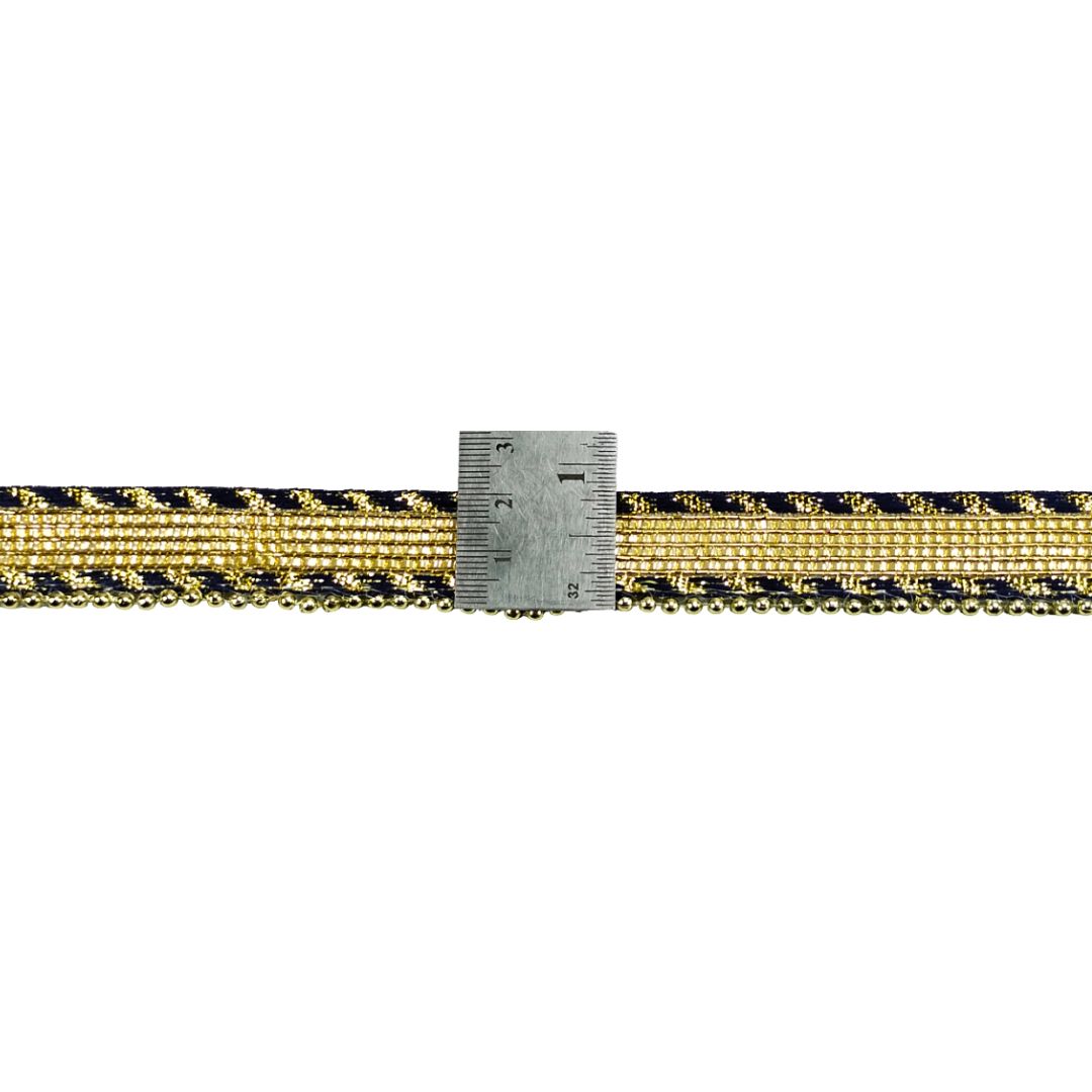 Gold and black braided cord with a ruler for scale on a white background